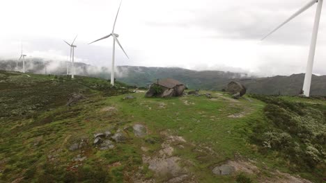 country house on green mountain with windmills