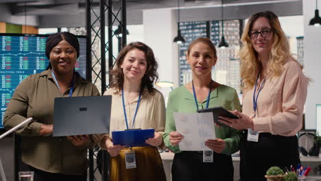 vertical video ambitious and goal oriented diverse businesswomen reviewing corporate reports