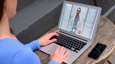 woman talking on video meeting on her laptop