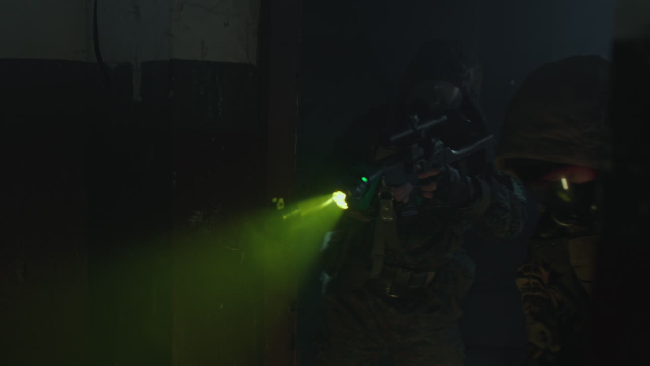 Military Operative in a Dark Building