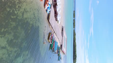 Vertical-shot-of-coast-in-Boca-Chica,-Dominican-Republic