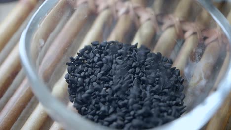 black seeds in a glass bowl