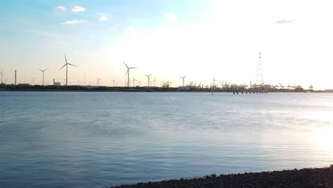 Push-out-drone-movement-with-an-overview-of-a-windmill-park-at-the-Antwerp-harbour