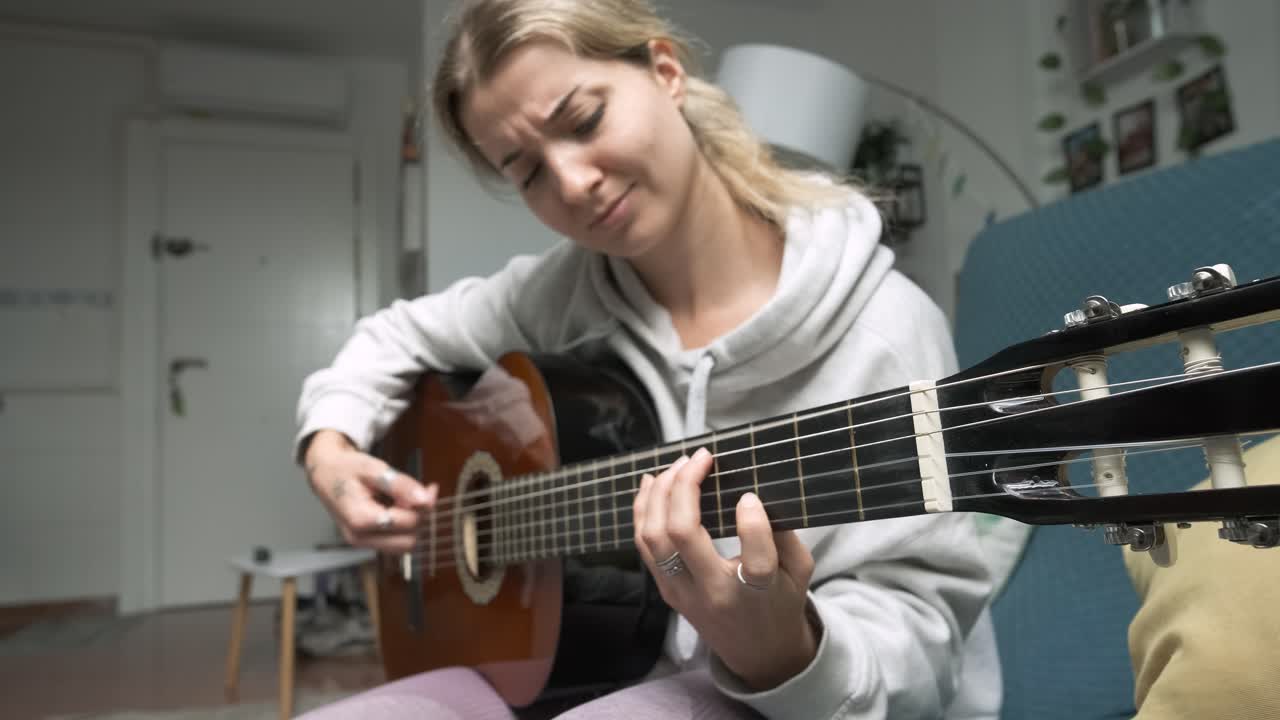 Captivating montage of a woman skillfully playing acoustic guitar