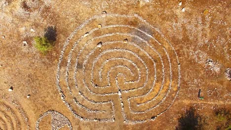 ancient labyrinth maze from stones. nature reserve of czech karst in czech republic.