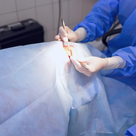 medical worker performing eye surgery