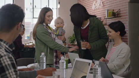 business people meeting team leader woman mother holding baby discussing corporate project with colleagues multitasking in modern office workplace