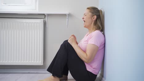 the woman is shouting in anger at home.