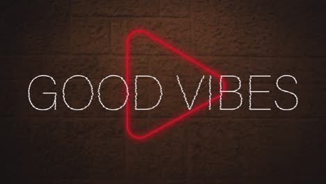 animación digital de buenas vibraciones texto sobre neón rojo icono de juego contra la pared de ladrillo