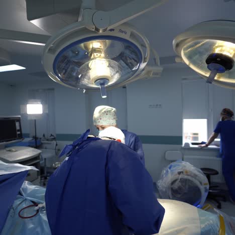 medical team working in surgical room. medical team of surgeons in the hospital performs minimally invasive surgical procedures