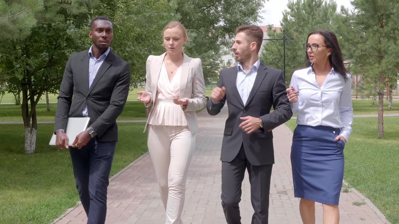 Business People Walking and Discussing