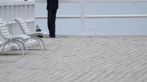 lonely person feeling depressed with suicidal thoughts standing at pier edge