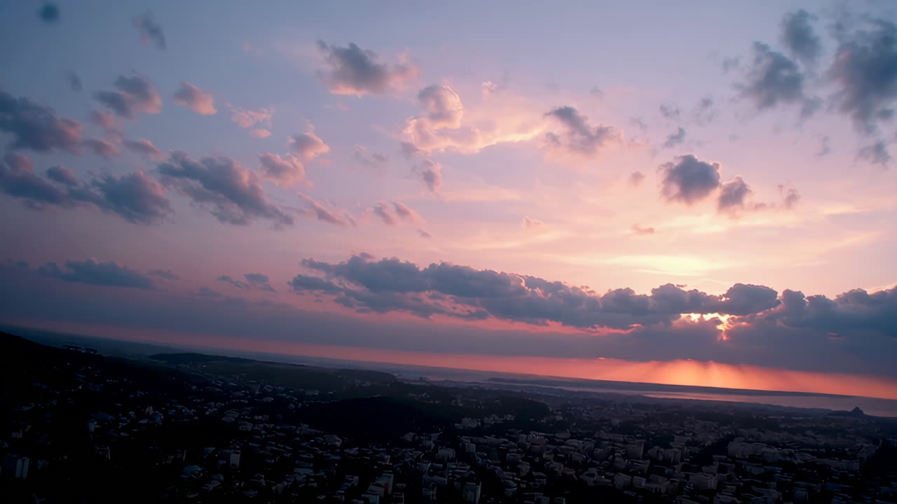 Sunset Skies Over City and Ocean