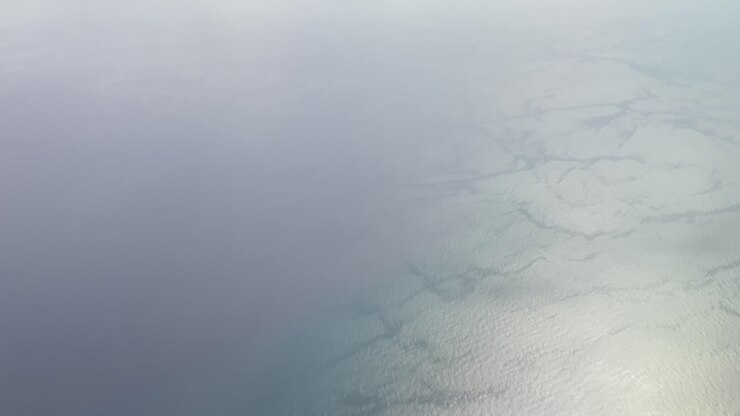 View of ocean waters from the window of a airplane over Florida