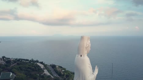 pictorial round motion buddha statue in religious complex