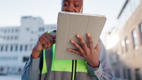 woman using tablet in urban setting