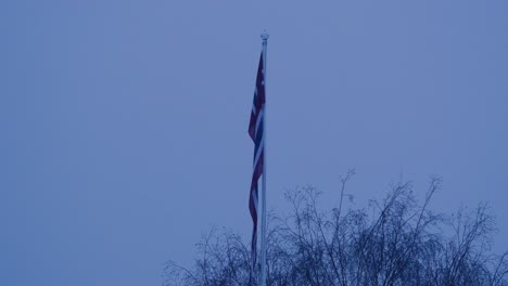 calm norwegian flag hanging down in winter