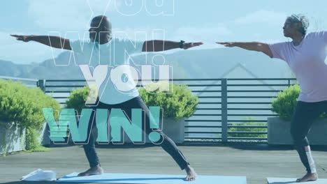 senior partners practicing yoga pose on mats showing animated you win! health overlay