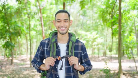 man hiking in a forest