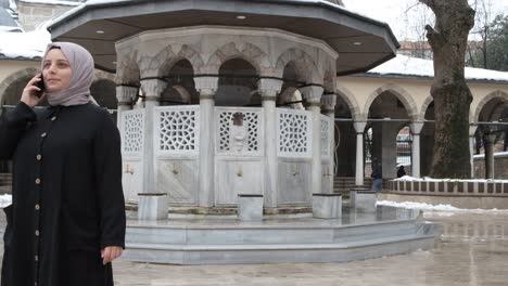 Phone-Call-In-Mosque-Courtyard