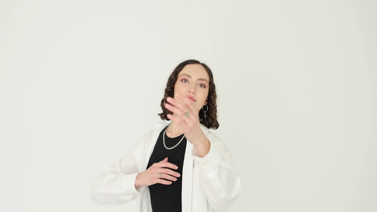 Young Woman Posing in Casual Attire on White Background