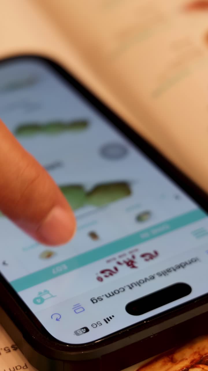 Hand interacts with smartphone food delivery app, warm lighting, shallow depth of field, close-up view
