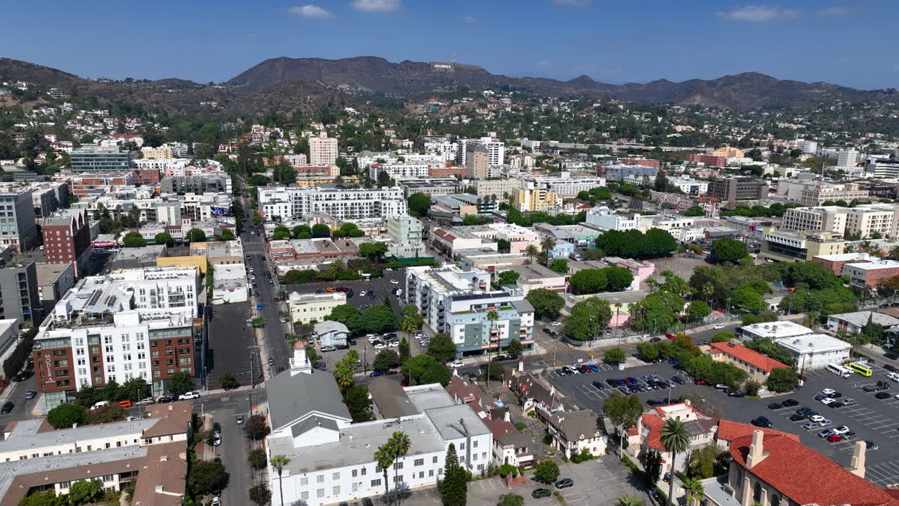Drone flying over the Hollywood cityscape, sunny day in Los Angeles, USA