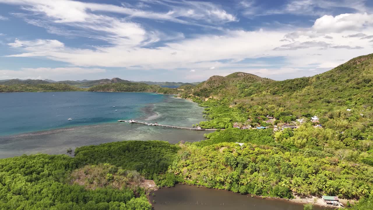 Panoramic Aerial View Of Dense Forests On The Mountains Near A Coastal Town In Busuanga Island, Philippines.