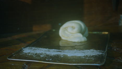 detail-shot-of-placing-bread-to-bake