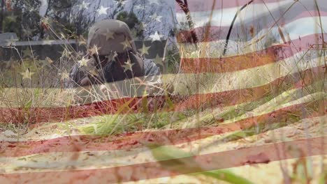 Military-man-with-gun-crawling-and-the-American-flag