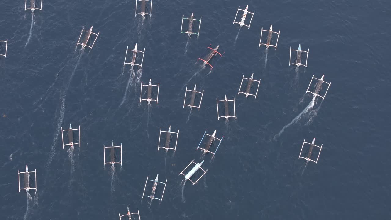 High view of tourist boats at sea during golden dawn in Bali