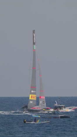 barcelona, spain - 31 august 2024 : boats racing in the amercia's cup 37 in vertical, 31 august 2024 in barcelona.