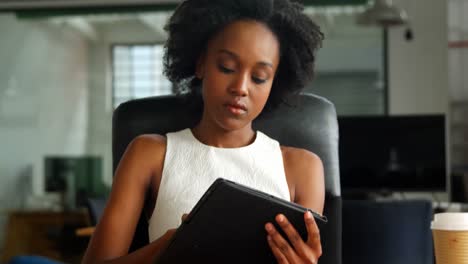 business executive using digital tablet in office