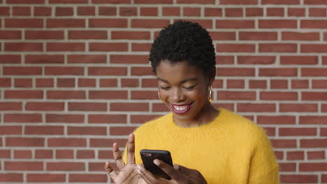 portrait of attractive stylish black woman using smarphone smiling enjoying texting browsing social media