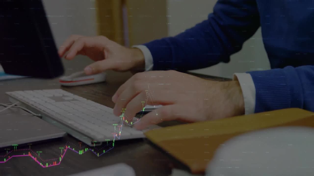 Animation of financial data processing over mid section of businessman using computer at office