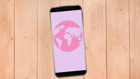 Animation-of-pink-breast-cancer-globe-logo-on-smartphone-screen