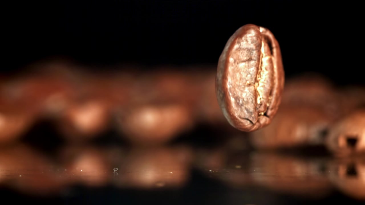 Single Coffee Bean Falling and Spinning in Slow Motion