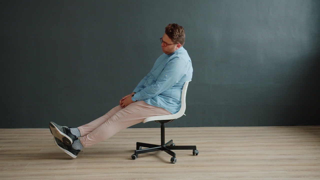 Man Sitting Comfortably in a Chair