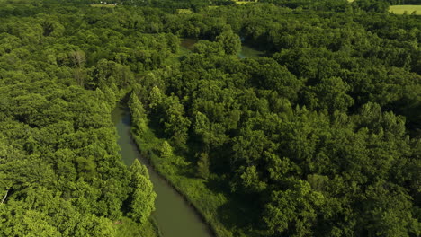 River-Surrounded-With-Lush-Green-Forests-In-Arkansas,-USA---aerial-drone-shot