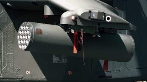 you can see an military attack helicopter and its weapons. alpha has a remove before fly band attached to it.