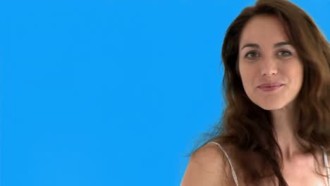 attractive woman playing with the camera and touching her hair