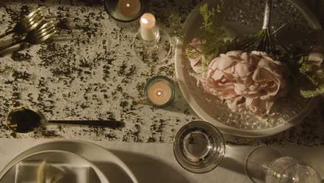 overhead shot of table set for meal at wedding reception with filled glasses of champagne 1