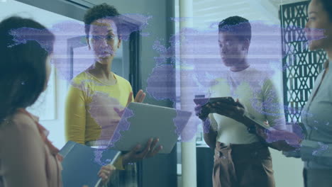 in office, diverse business team discussing with digital world map overlaying meeting