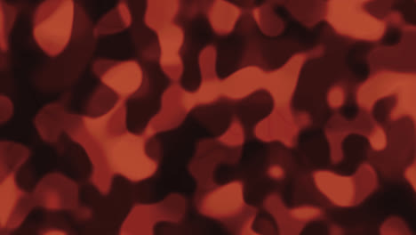 looping animations of an orange and black liquid camouflage like pattern