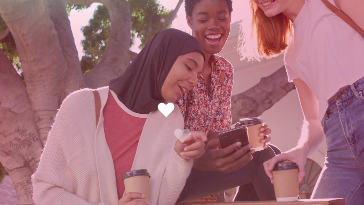 Three women bench mid scrolling phone left tapping causing hearts growing lens flare marketing