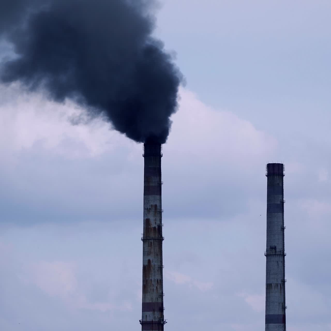 Factory pipes with smoke