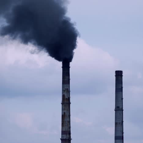 factory pipes with smoke