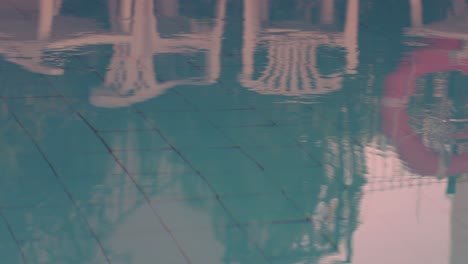 reflection of chairs at the swimming pool