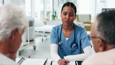 Woman,-nurse-and-talking-to-couple-in-clinic