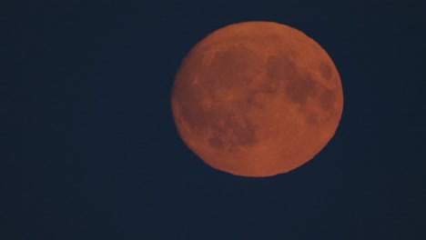 full moon on dark cloudy night